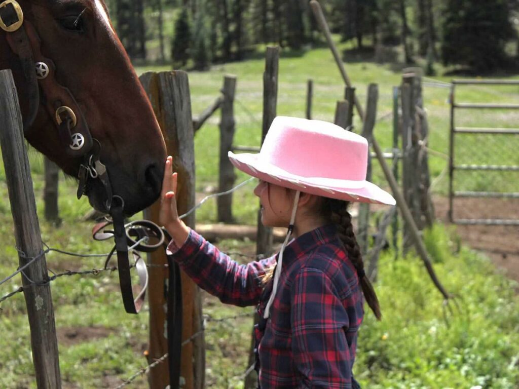 Young Girl Petting Horse Arizona Dude Ranch
