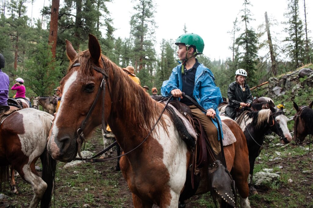 Kids and families enjoy trail rides during their horseback riding vacations in Arizona